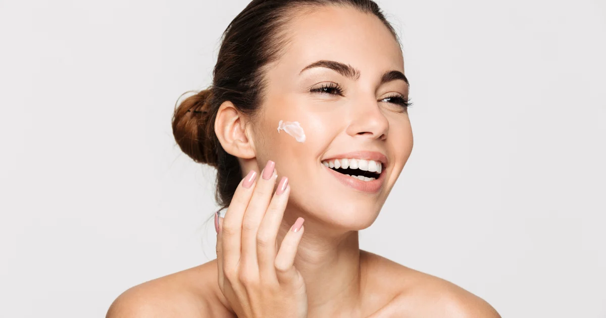 Woman applying EltaMD sunscreen to her face for daily protection in Sanford, FL