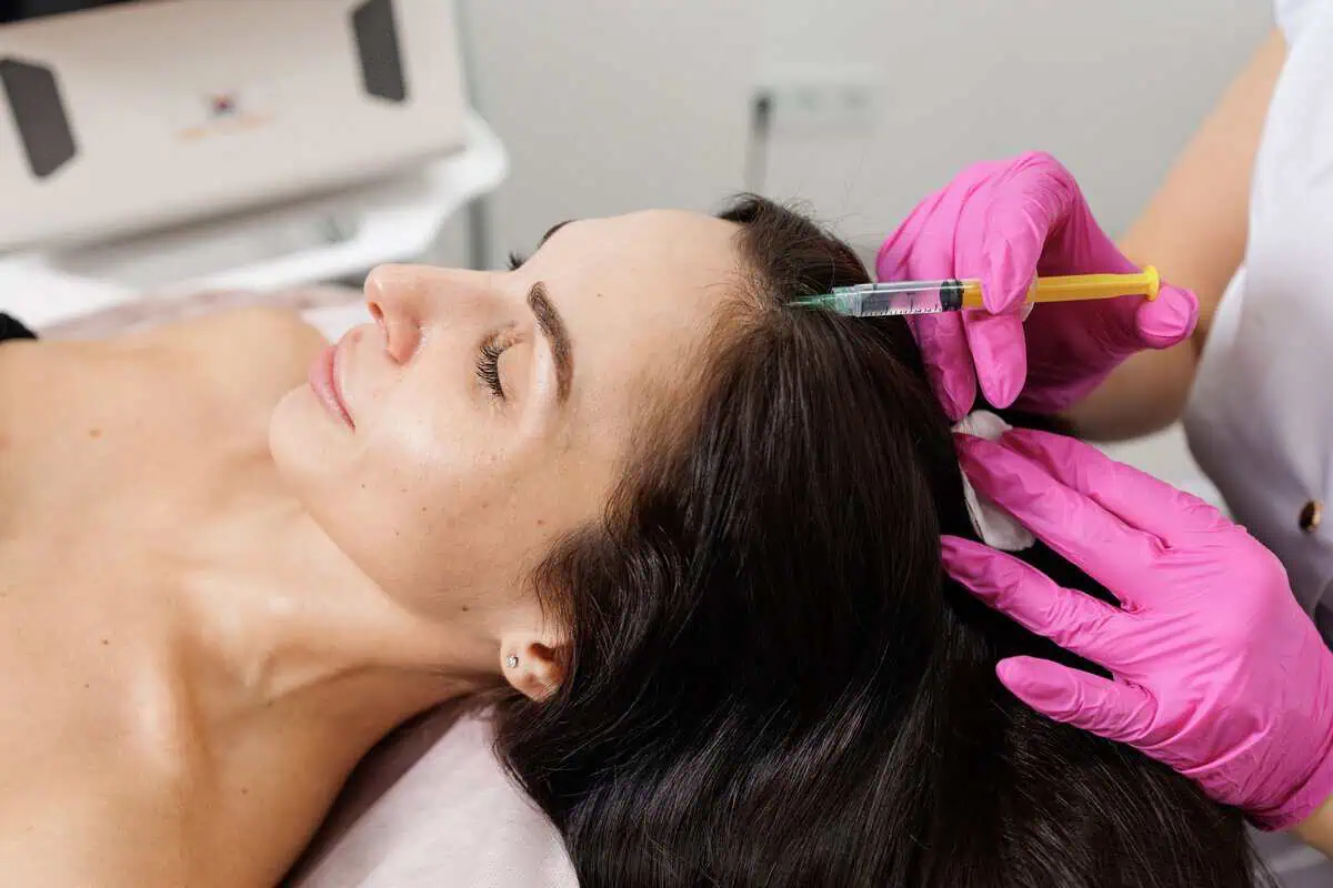 Provider performing PRF Hair Restoration injections for thinning hair in Orlando, FL.